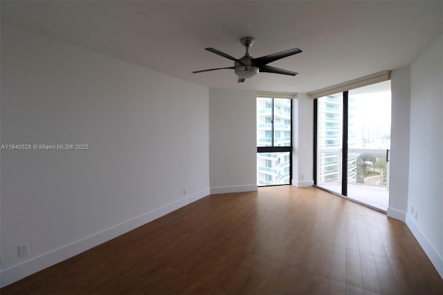 20185 E Country Club Dr Unit 1105, Aventura, FL 33180 - empty room with floor to ceiling windows, ceiling fan, and wood finished floors