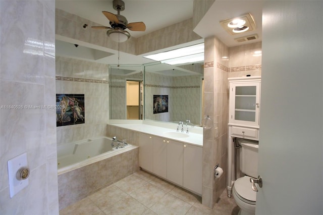 20185 E Country Club Dr Unit 1105, Aventura, FL 33180 - full bath featuring tile patterned flooring, a jetted tub, a ceiling fan, vanity, and tile walls