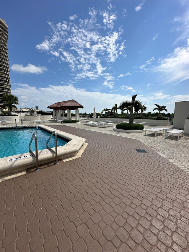 20185 E Country Club Dr Unit 1105, Aventura, FL 33180 - community pool featuring a gazebo and a patio