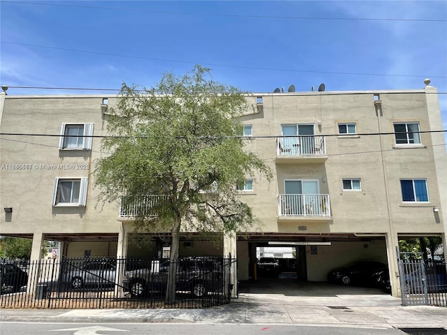 3201 W Flagler St Unit 102, Miami, FL 33135 - view of apartment building / complex featuring a garage