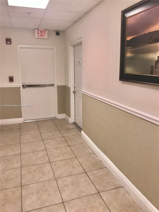 3201 W Flagler St Unit 102, Miami, FL 33135 - corridor with light tile patterned flooring and a drop ceiling