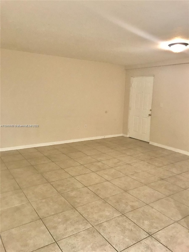 3201 W Flagler St Unit 102, Miami, FL 33135 - unfurnished room featuring baseboards and light tile patterned flooring