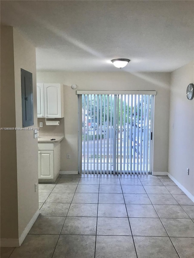 3201 W Flagler St Unit 102, Miami, FL 33135 - spare room with light tile patterned flooring and electric panel
