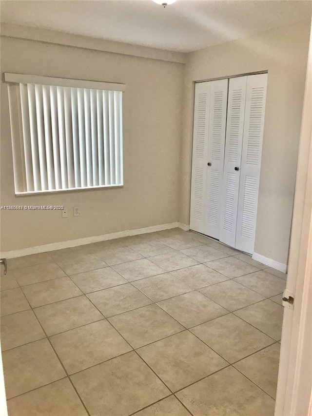 3201 W Flagler St Unit 102, Miami, FL 33135 - unfurnished bedroom with a closet and tile patterned floors