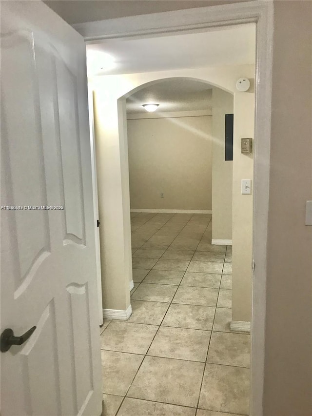 3201 W Flagler St Unit 102, Miami, FL 33135 - hall featuring arched walkways and light tile patterned flooring