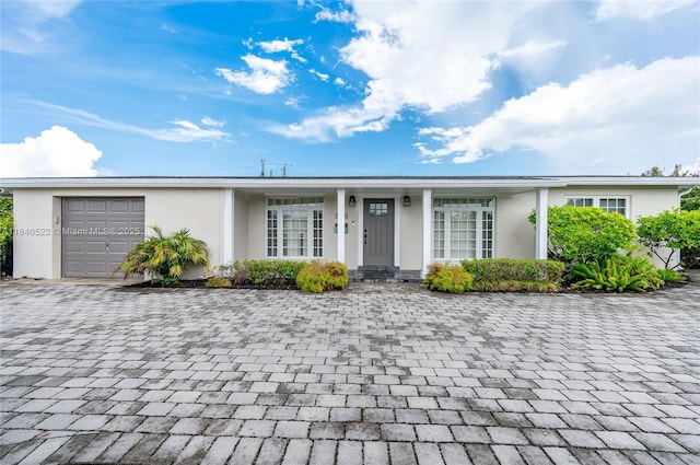 9370 SW 61st St, Miami, FL 33173 - single story home featuring an attached garage, stucco siding, and decorative driveway