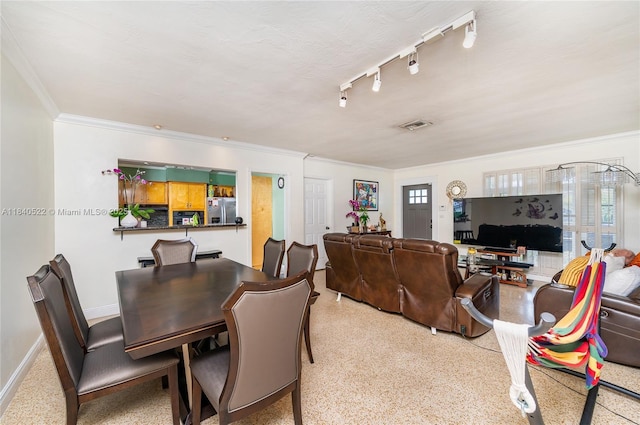 9370 SW 61st St, Miami, FL 33173 - living room featuring crown molding, dark aggregate flooring, and track lighting