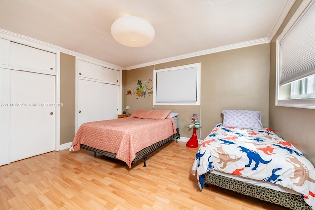 9370 SW 61st St, Miami, FL 33173 - bedroom featuring light wood-style flooring, crown molding, and a closet
