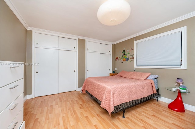 9370 SW 61st St, Miami, FL 33173 - bedroom with multiple closets, light wood finished floors, and crown molding