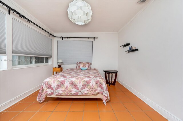 9370 SW 61st St, Miami, FL 33173 - tiled bedroom featuring ornamental molding and baseboards