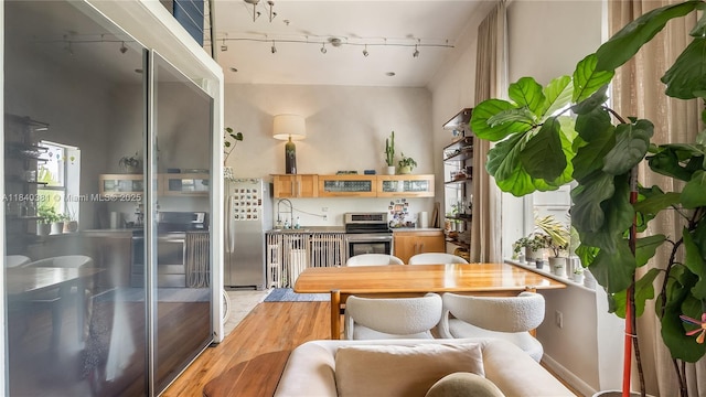 1521 Lenox Ave Unit 307, Miami Beach, FL 33139 - dining space featuring rail lighting and light wood-style floors