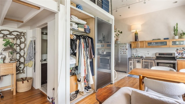 1521 Lenox Ave Unit 307, Miami Beach, FL 33139 - kitchen featuring stainless steel appliances and light wood-style floors