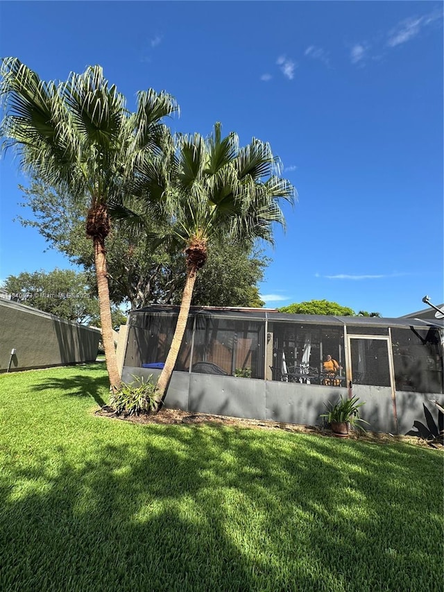 1341 W Fairway Rd Unit 1, Pembroke Pines, FL 33026 - view of grassy yard featuring a sunroom