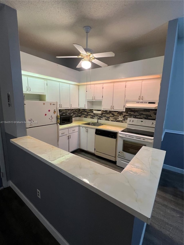 10415 E Clairmont Cir Unit 212, Tamarac, FL 33321 - kitchen featuring white appliances, decorative backsplash, ceiling fan, white cabinets, and a textured ceiling