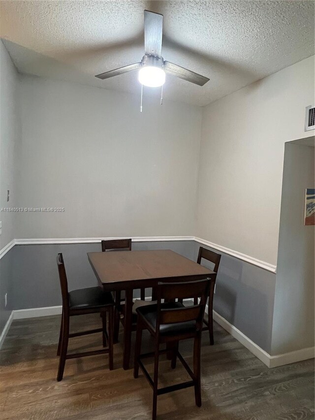 10415 E Clairmont Cir Unit 212, Tamarac, FL 33321 - dining area with wood finished floors, a textured ceiling, and ceiling fan