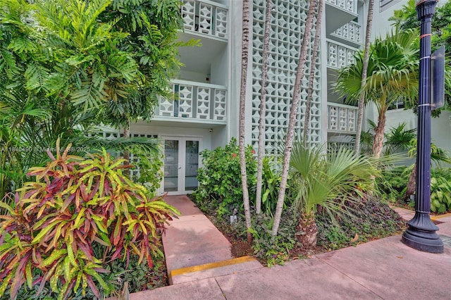 1100 11th St Unit 204, Miami Beach, FL 33139 - entrance to property with french doors, a balcony, and stucco siding