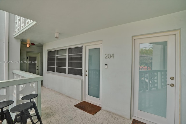 1100 11th St Unit 204, Miami Beach, FL 33139 - doorway to property featuring stucco siding