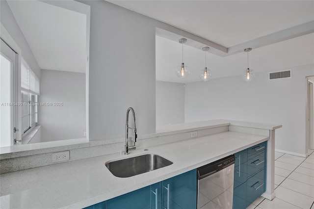 1100 11th St Unit 204, Miami Beach, FL 33139 - kitchen featuring blue cabinetry, dishwasher, pendant lighting, light tile patterned floors, and light countertops