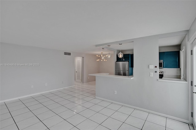 1100 11th St Unit 204, Miami Beach, FL 33139 - unfurnished room featuring a chandelier and light tile patterned flooring