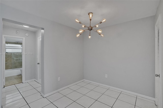 1100 11th St Unit 204, Miami Beach, FL 33139 - unfurnished room with light tile patterned flooring and a chandelier