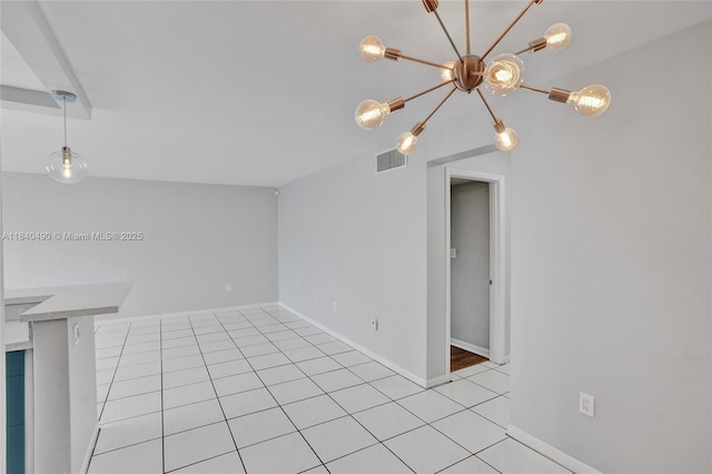 1100 11th St Unit 204, Miami Beach, FL 33139 - unfurnished room featuring a chandelier and light tile patterned floors