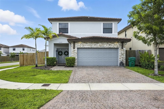 25009 SW 108th Ave, Homestead, FL 33032 - traditional-style house featuring decorative driveway, stone siding, a garage, and stucco siding