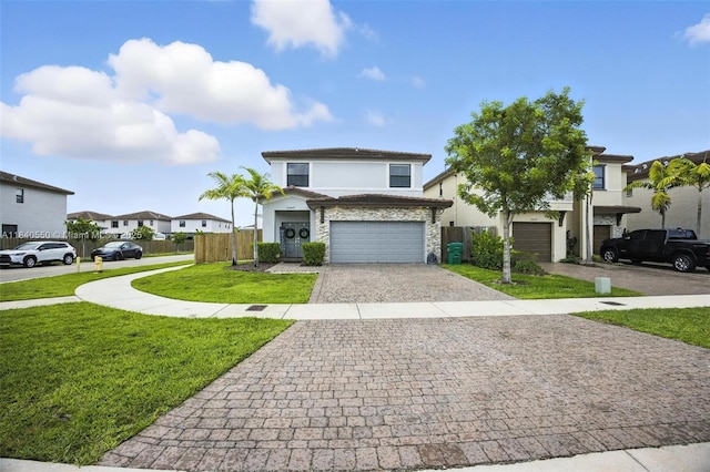 25009 SW 108th Ave, Homestead, FL 33032 - traditional home featuring decorative driveway, a garage, stucco siding, a residential view, and stone siding
