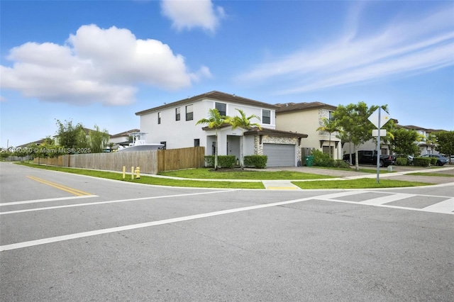 25009 SW 108th Ave, Homestead, FL 33032 - view of front facade with stucco siding, a garage, and driveway