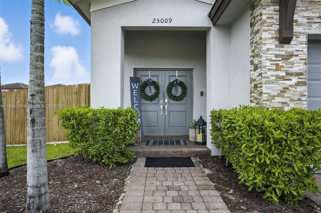 25009 SW 108th Ave, Homestead, FL 33032 - property entrance with stucco siding