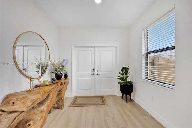 25009 SW 108th Ave, Homestead, FL 33032 - entryway with light wood finished floors and baseboards