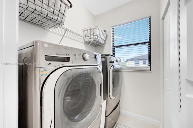 25009 SW 108th Ave, Homestead, FL 33032 - washroom featuring washing machine and clothes dryer and tile patterned floors