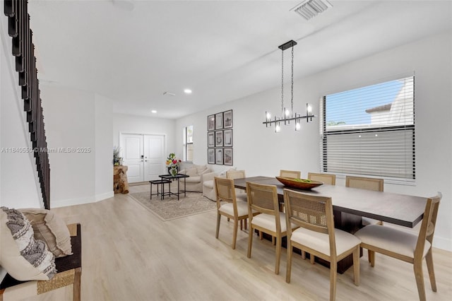 25009 SW 108th Ave, Homestead, FL 33032 - dining space featuring stairs, light wood-style flooring, and recessed lighting