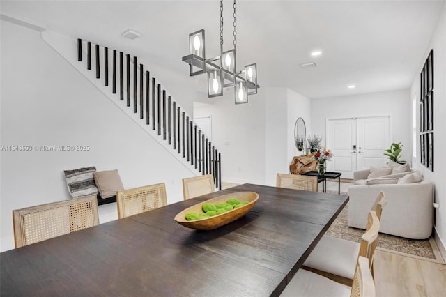 25009 SW 108th Ave, Homestead, FL 33032 - dining space with stairs, light wood finished floors, and recessed lighting