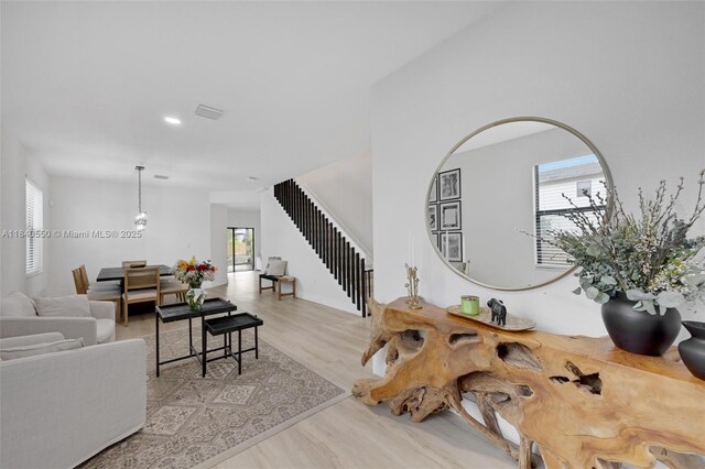 25009 SW 108th Ave, Homestead, FL 33032 - living room with stairs, wood finished floors, and recessed lighting