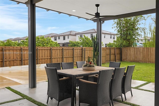 25009 SW 108th Ave, Homestead, FL 33032 - fenced backyard featuring a patio area, outdoor dining space, and a residential view