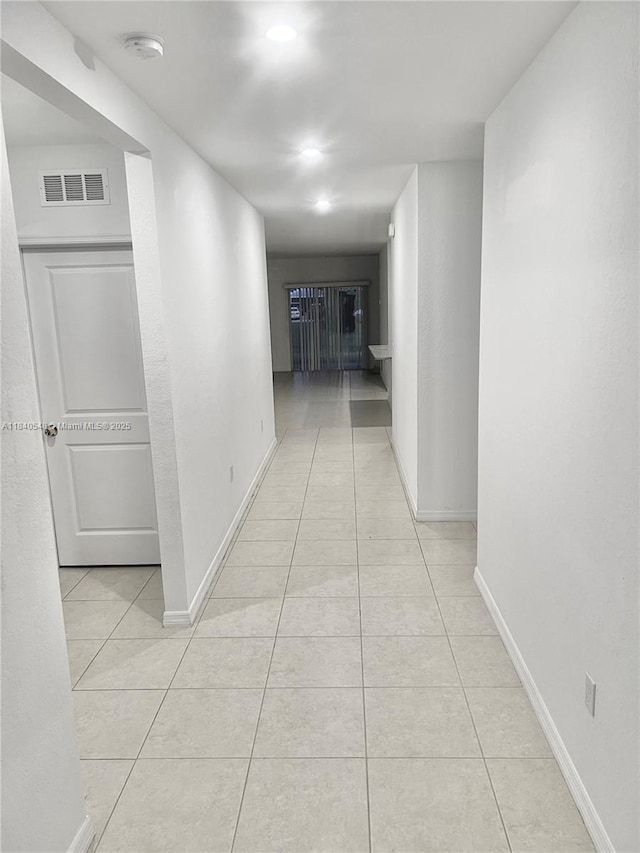 982 SW Alcantarra Blvd, Port St Lucie, FL 34953 - hallway featuring light tile patterned floors and recessed lighting