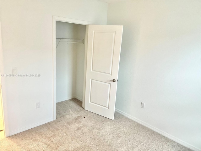 982 SW Alcantarra Blvd, Port St Lucie, FL 34953 - unfurnished bedroom with light colored carpet and a closet