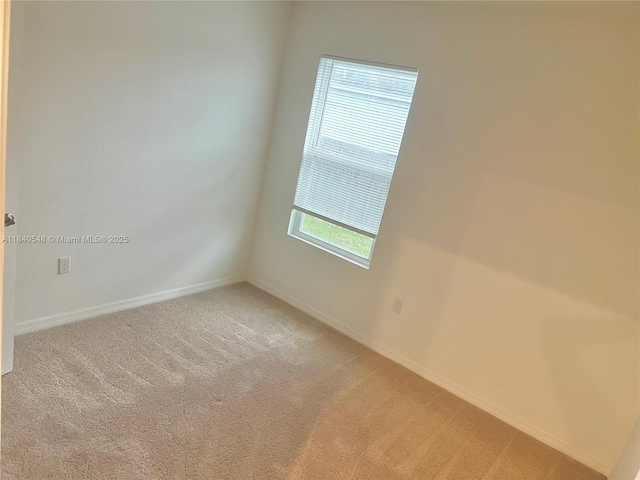 982 SW Alcantarra Blvd, Port St Lucie, FL 34953 - spare room with light carpet and baseboards