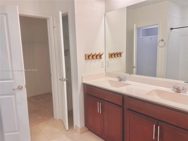 982 SW Alcantarra Blvd, Port St Lucie, FL 34953 - bathroom featuring double vanity, tile patterned floors, and a shower