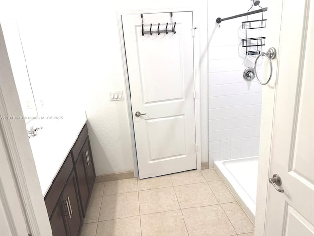 982 SW Alcantarra Blvd, Port St Lucie, FL 34953 - full bathroom featuring vanity, tile patterned flooring, and a shower