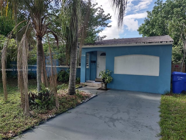 2506 Mayo St, Hollywood, FL 33020 - view of front of house with stucco siding and roof with shingles