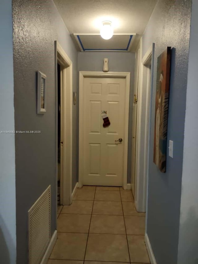 2506 Mayo St, Hollywood, FL 33020 - corridor with light tile patterned floors and baseboards