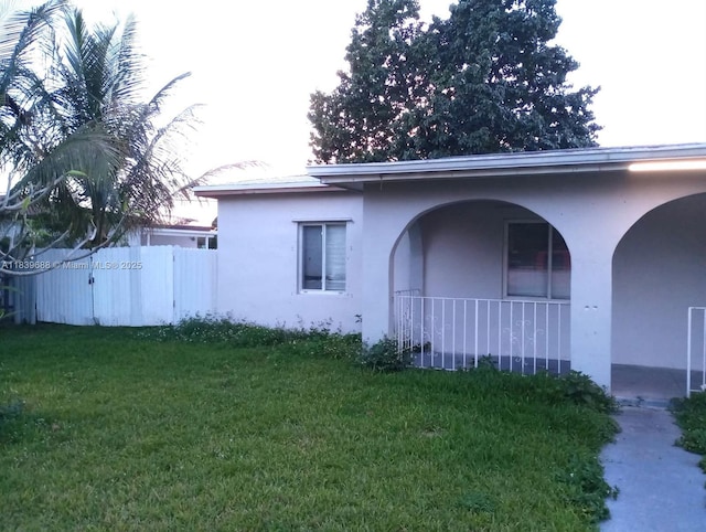 14760 Tyler St, Miami, FL 33176 - view of side of property featuring a porch and stucco siding