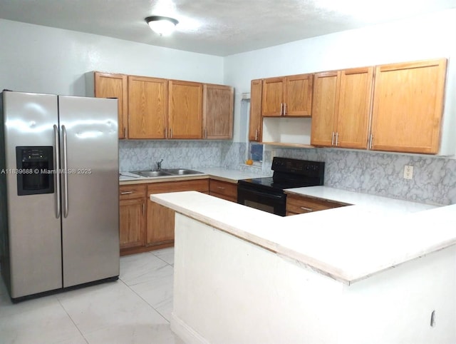 14760 Tyler St, Miami, FL 33176 - kitchen featuring stainless steel fridge, black range with electric stovetop, a peninsula, light countertops, and decorative backsplash
