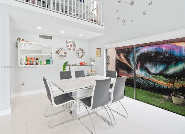 1000 NE 204th Ln Unit D, Miami, FL 33179 - dining area with tile patterned floors, a towering ceiling, and recessed lighting