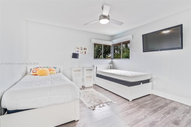 1000 NE 204th Ln Unit D, Miami, FL 33179 - bedroom featuring wood finished floors and a ceiling fan
