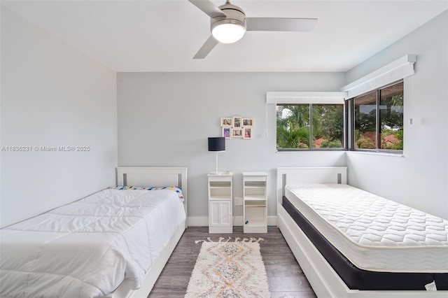 1000 NE 204th Ln Unit D, Miami, FL 33179 - bedroom featuring wood finished floors and a ceiling fan