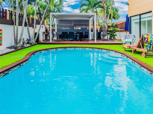 1000 NE 204th Ln Unit D, Miami, FL 33179 - view of swimming pool featuring a deck and a fenced backyard