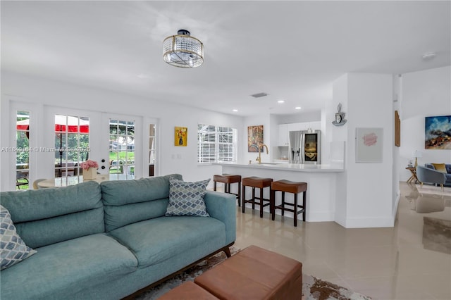 1204 Bayview Cir, Weston, FL 33326 - living room with light tile patterned floors and recessed lighting