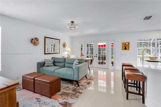 1204 Bayview Cir, Weston, FL 33326 - living room featuring french doors and light tile patterned floors
